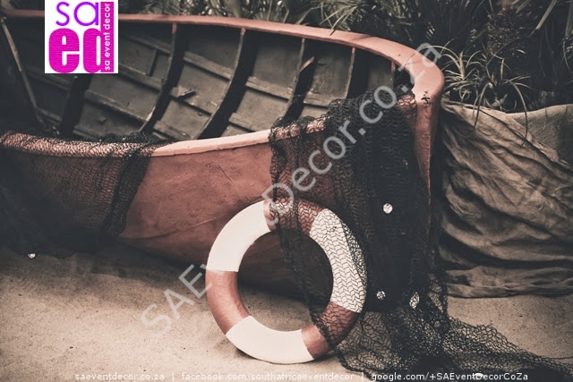 Beach function decor. Old boat and netting