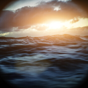From the porthole window of a vessel in a rough sea